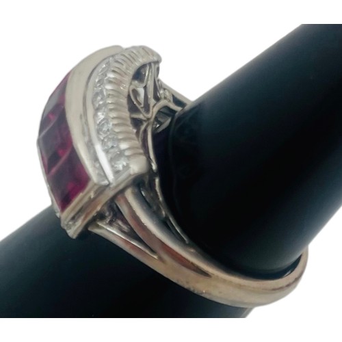 199 - An 18ct white gold dress ring, invisible set with 5 x princess cut rubies to the centre, each ruby w... 