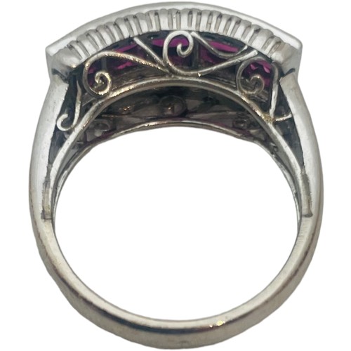 199 - An 18ct white gold dress ring, invisible set with 5 x princess cut rubies to the centre, each ruby w... 