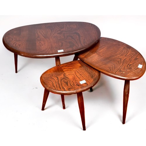 542 - A nest of three dark stained elm coffee tables by Ercol and 	a stained-wood three-fold dressing scre... 