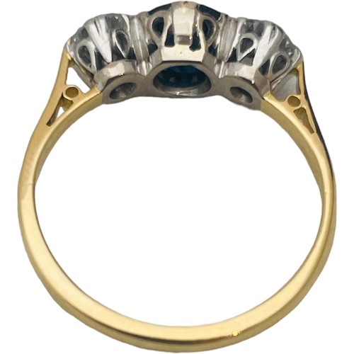 244 - An 18ct yellow gold sapphire and diamond ring, set with a round sapphire to the centre, flanked by t... 