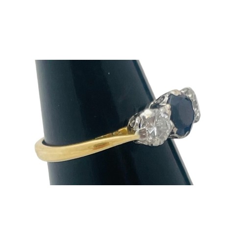 244 - An 18ct yellow gold sapphire and diamond ring, set with a round sapphire to the centre, flanked by t... 