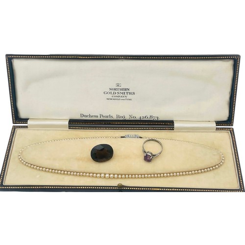 245 - A faux pearl necklace, with silver clasp, in original box, by Northern Goldsmiths Company, together ... 