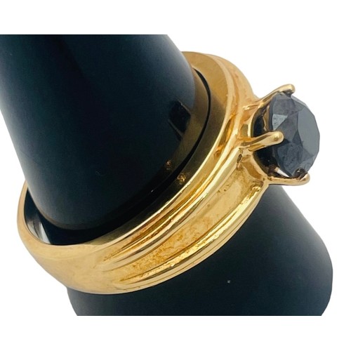 250 - An 18ct yellow gold dress ring, set with a round faceted stone, ring weighs 8.6 grams.