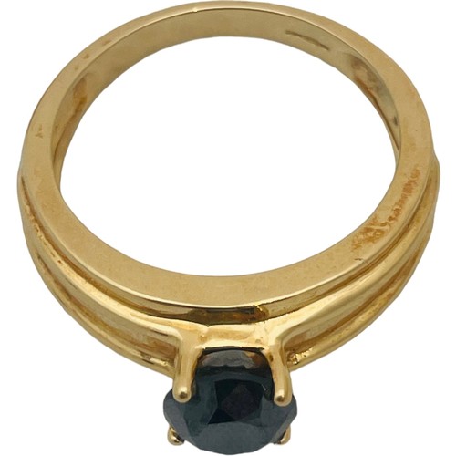 250 - An 18ct yellow gold dress ring, set with a round faceted stone, ring weighs 8.6 grams.