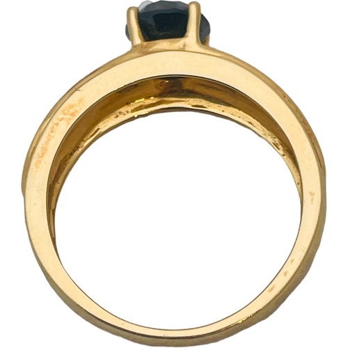 250 - An 18ct yellow gold dress ring, set with a round faceted stone, ring weighs 8.6 grams.