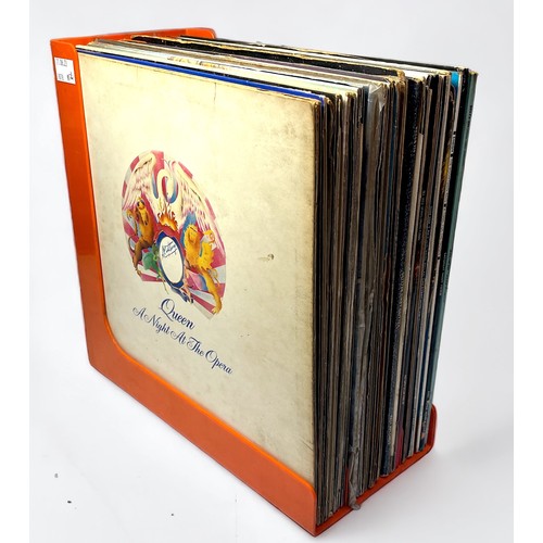 374 - Twenty-nine assorted 12” vinyl LP records comprising popular rock bands and artists, to include, Que... 