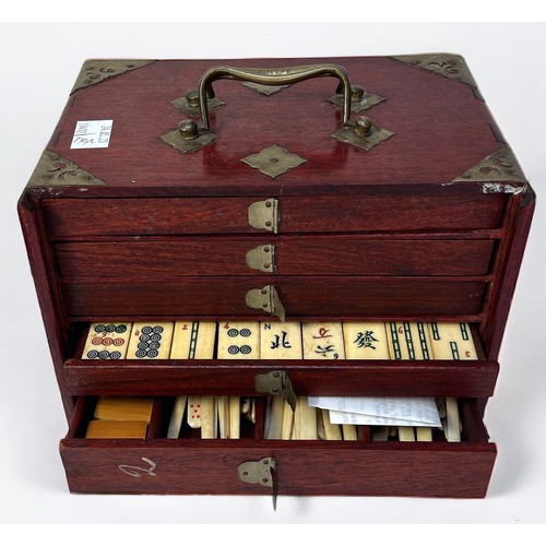 312 - A bone tile Mahjong set, housed in fitted wooden box with handles, with four wooden tile racks