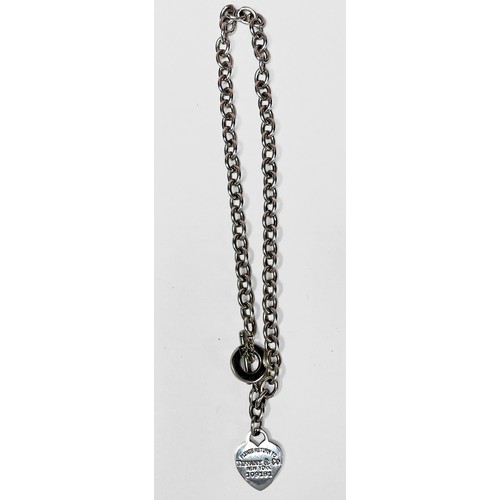 243 - A silver Tiffany style necklace, with oval links and heart shaped pendant, in Tiffany & Co. branded ... 