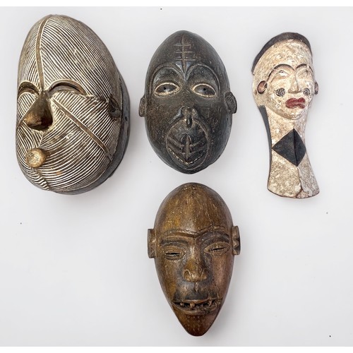 324 - Four African Carved Wooden Tribal Masks, including Bulu Monkey mask, Punde tribe and two others. (4)... 