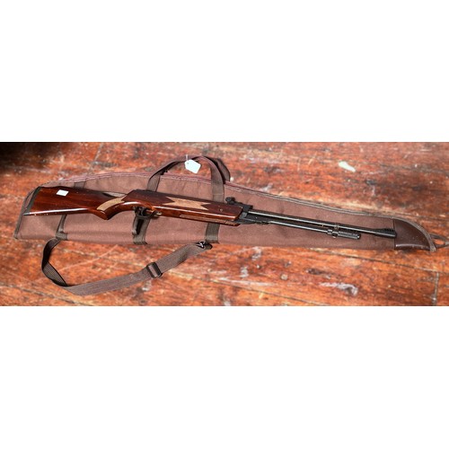 309 - A Sportsmarketing SMKDB5 .22 air rifle, with walnut stock and canvas carry bag