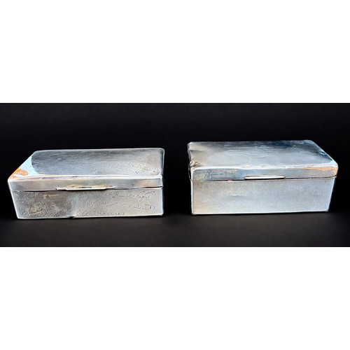 33 - Two silver cigarette boxes, both presented to Lieutenant Commander E. F. Coggins, one to commemorate... 