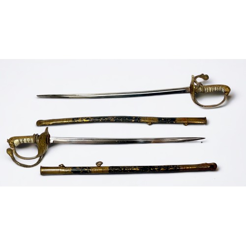 403 - Two paper knives/letter openers modelled as Naval Officers dress swords, both with scabbards, 24.5cm... 