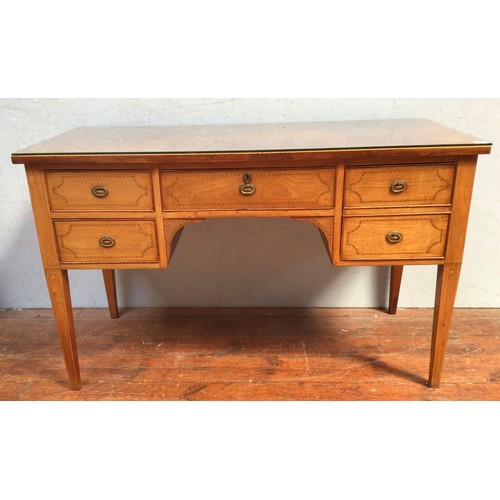 546 - An Edwardian inlaid walnut desk, the frieze with three drawers, above two further drawers, raised on... 