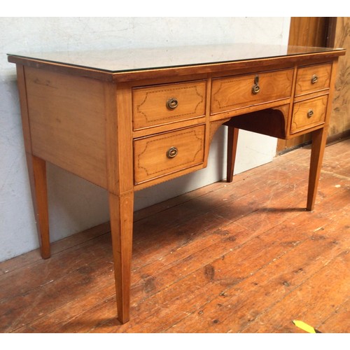 546 - An Edwardian inlaid walnut desk, the frieze with three drawers, above two further drawers, raised on... 