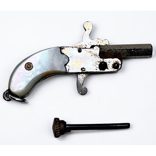 331 - A miniature pinfire pistol, with 14mm hexagonal breach-loading barrel and two-piece mother-of-pearl ... 