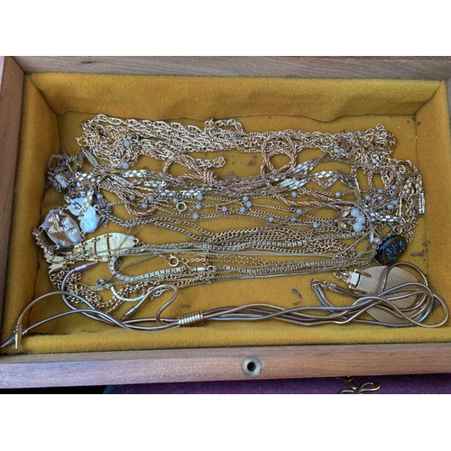 255 - A quantity of costume jewellery and ladies watches and including a pair of silver '8' cufflinks, sil... 