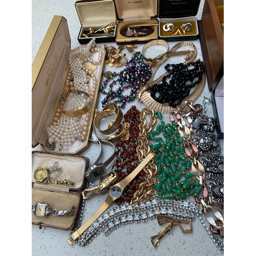 255 - A quantity of costume jewellery and ladies watches and including a pair of silver '8' cufflinks, sil... 