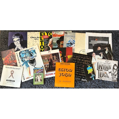 378 - A collection of assorted Elton John concert programmes, magazines, books and souvenirs comprising el... 