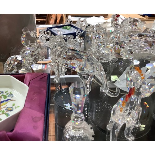 55 - A good collection of approximately 53 Swarovski crystal figures, including a great white shark, a Ch... 