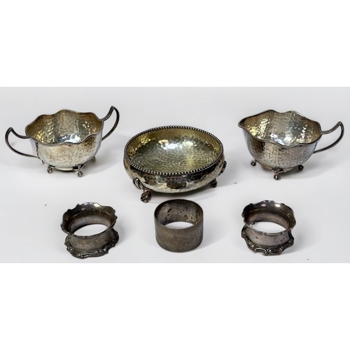 79 - Three silver napkin rings, gross weight approximately 2.8ozt, together with three silver-plated plan... 