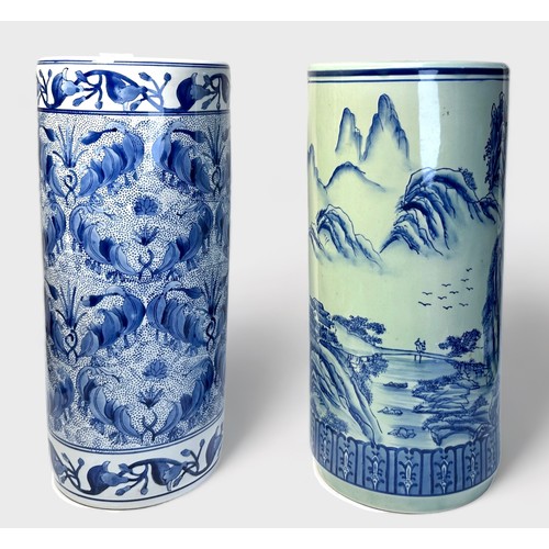 60 - Two modern Oriental blue and white porcelain umbrella stands of plain cylindrical form, one depictin... 