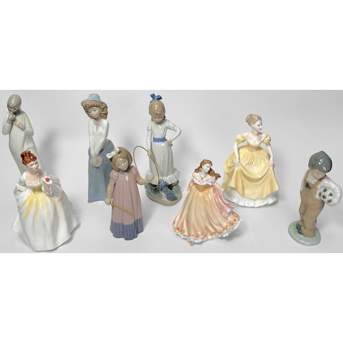 9 - A collection of assorted ceramic figures including a Royal Doulton ‘Flower of Love HN2460’, Coalport... 