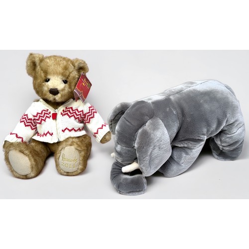 369 - A collection of four various teddy bears / soft plush toys, to include, The Harrods Christmas Bear f... 