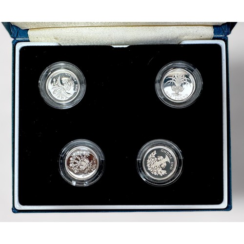 262 - Four Royal Mint cased sets of silver proof one pound coins, including a 1984 - 87 set and a 1994 - 1... 