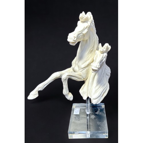 21 - A Royal Doulton 'Millennium 2000' limited edition Parian porcelain model of two horses with bodies e... 