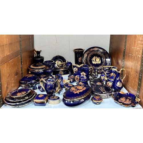 28 - A collection of assorted Limoges navy blue and gilt ornaments, some marked ‘La Reine’, including vas... 