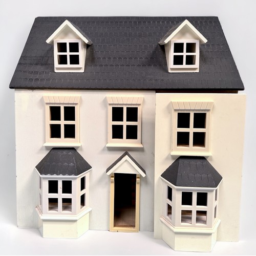 370 - Two modern wooden dolls houses, including a Pintoy example with stained wood finish and red roof, to... 