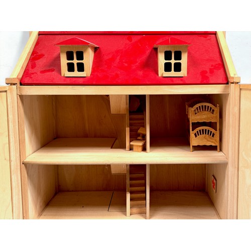 370 - Two modern wooden dolls houses, including a Pintoy example with stained wood finish and red roof, to... 