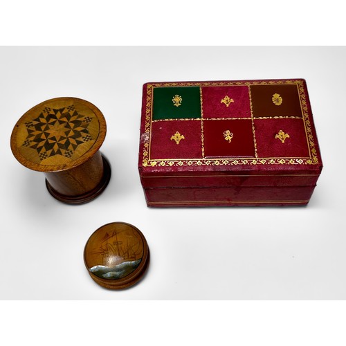 341 - A treen nutmeg grater with parquetry decoration to top, 5cm tall, together with a small treen pill b... 