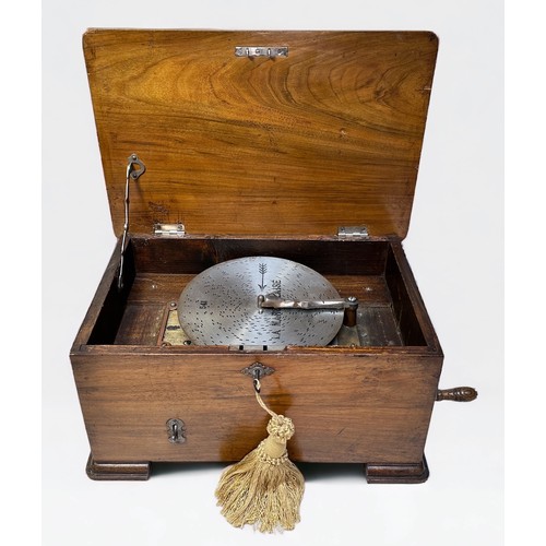 346 - An Edwardian Polyphon, with side winding handle, with 17x metal music discs, in walnut case with Aus... 