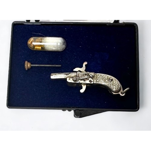 343 - An Austrian miniature pinfire pistol, with 15mm breech-loading hexagonal barrel and foliate engraved... 