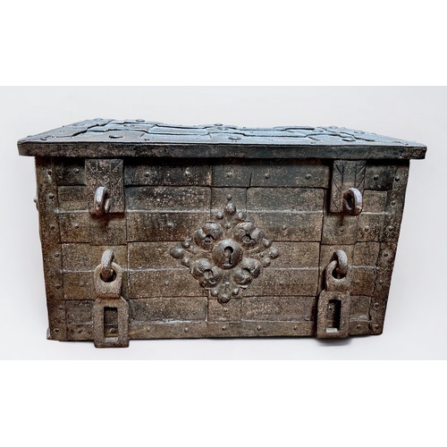 340 - A 17th century iron and iron bound strong box or 'Armada' chest of rectangular form, bound in rivete... 