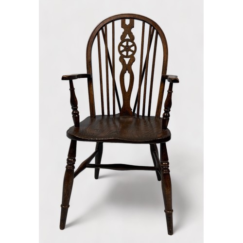 568 - A pair of 19th Century ash and elm seated wheelback Windsor armchairs, raised on turned supports, st... 