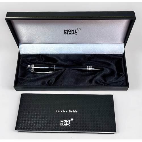 351 - A Montblanc Starwalker black resin rollerball pen, with screw cap and white metal fittings, with ser... 