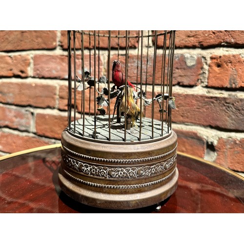 358 - A 20th century singing bird automaton modelled as a birdcage housing two birds, one red and one yell... 