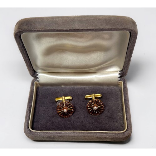 254B - A pair of 14ct gold Mikimoto cufflinks, the front modelled as a stylised chrysanthemum centrally set... 