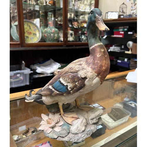 53 - A collection of assorted mixed ceramics comprising a David Sharp for Rye pottery model of a bird, a ... 