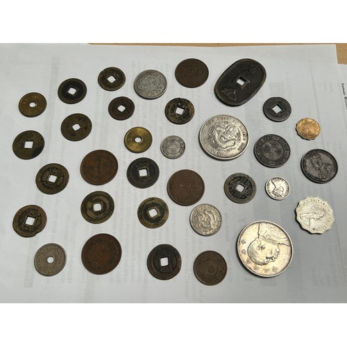 255 - A box of British and foreign coins mostly 20th century but there are some later and a number of earl... 