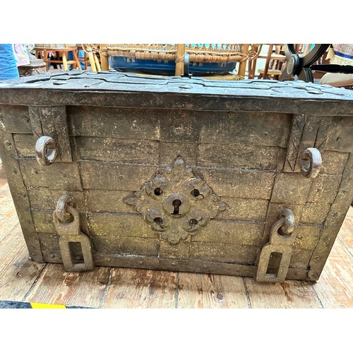 340 - A 17th century iron and iron bound strong box or 'Armada' chest of rectangular form, bound in rivete... 