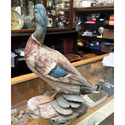 10 - A collection of assorted mixed ceramics comprising a David Sharp for Rye pottery model of a bird, a ... 