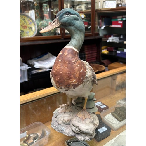 10 - A collection of assorted mixed ceramics comprising a David Sharp for Rye pottery model of a bird, a ... 