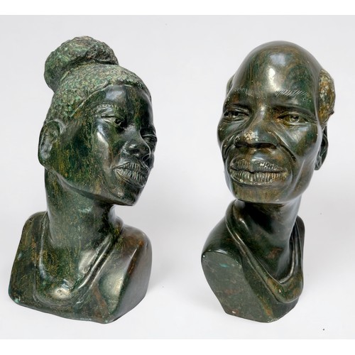 330 - Two African carved verdite stone busts of a native man and woman, approximately 20cm high, together ... 