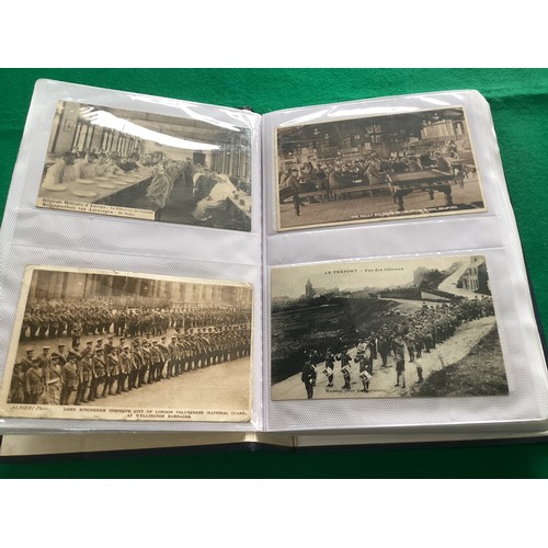 251 - An album containing 192 military cards – including art, comic, camp life, patriotic and some real ph... 