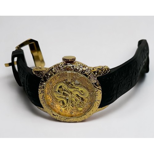 100 - A gents gold-plated Genoa wristwatch, the gilt dial with white stone hour markers and relief moulded... 