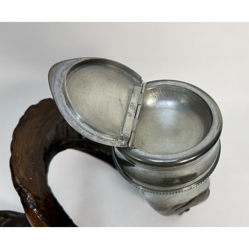 395 - A ram's horn snuff mull with white-metal mounts and eagle finial to the hinged cover, 30cm long