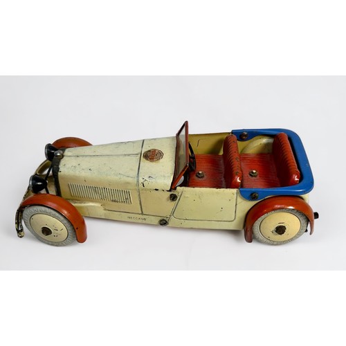 546 - A made-up Meccano tin-plate and clockwork car, white rubber wheels, finished in cream red and blue w... 